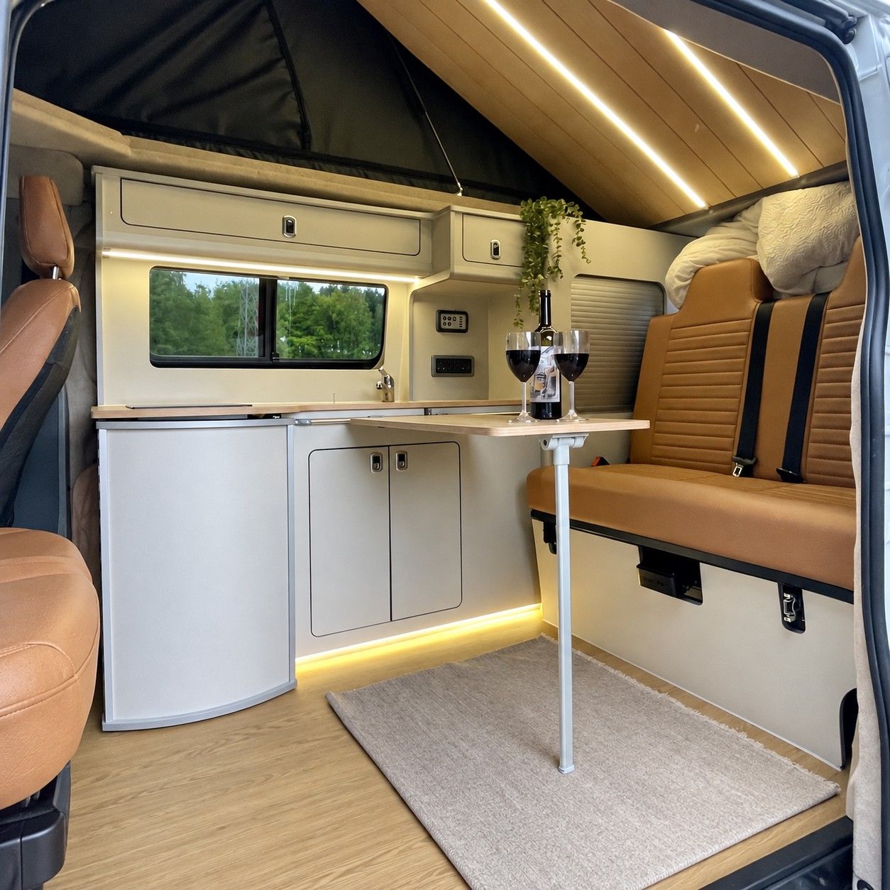 Side kitchen & dining: Fold-out table set for two.
