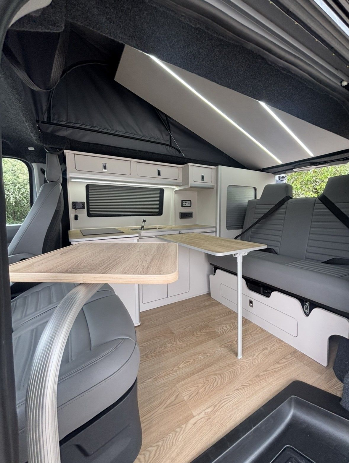 Dining layout: Swivel seat and fold-out tables.